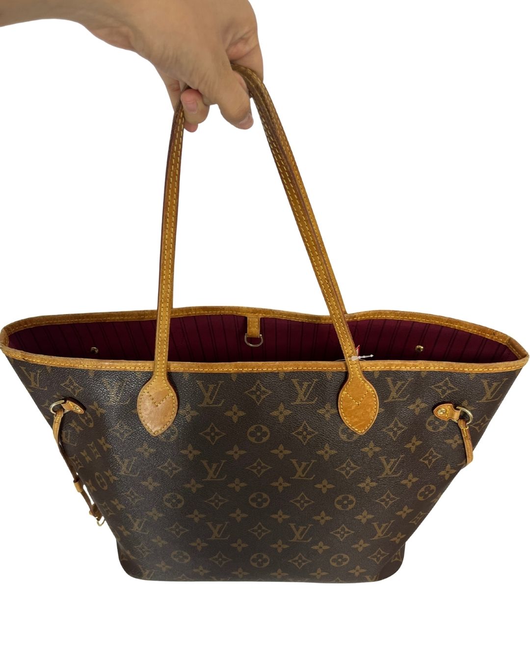 Top view of Louis Vuitton brown monogram tote bag with burgundy interior