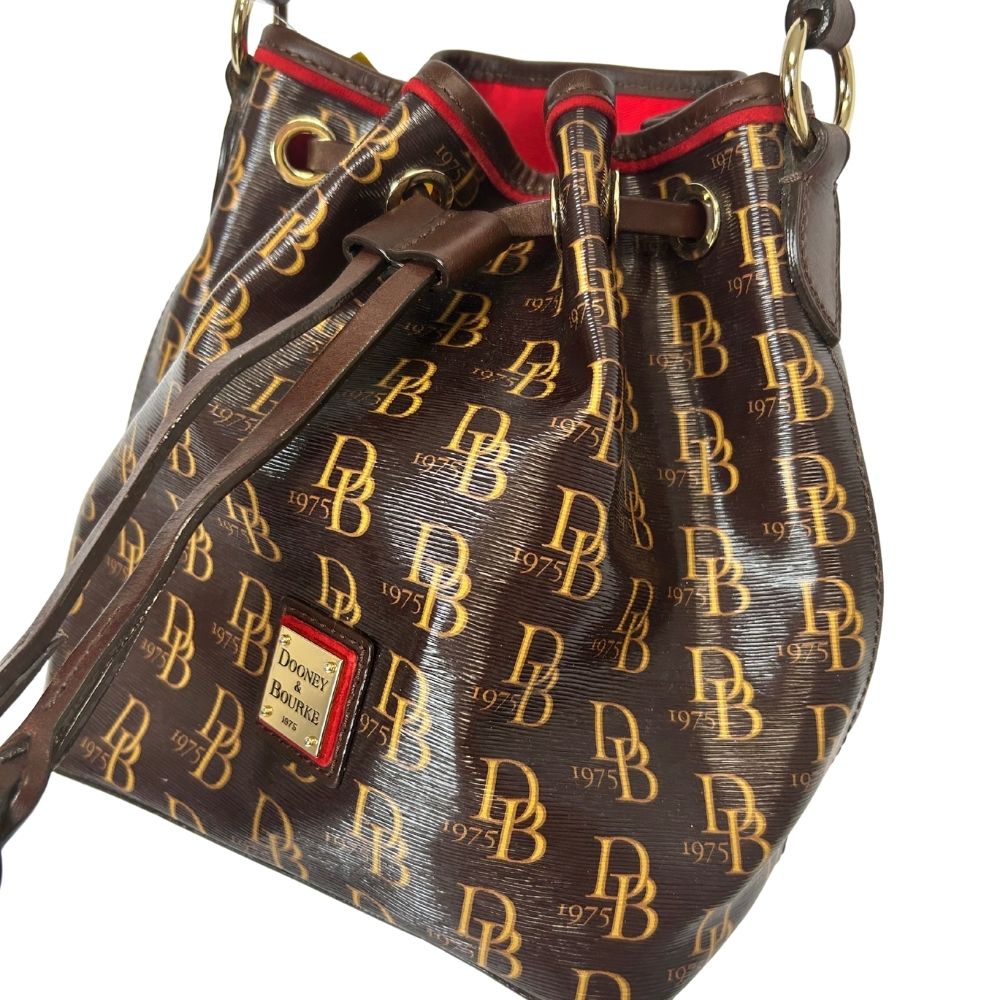 Dooney & Bourke Gold Logo Leather Drawstring Bag – Brown Plaid