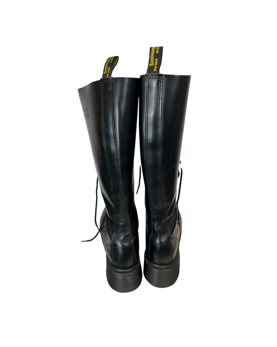 Back view of black leather knee high platform boots