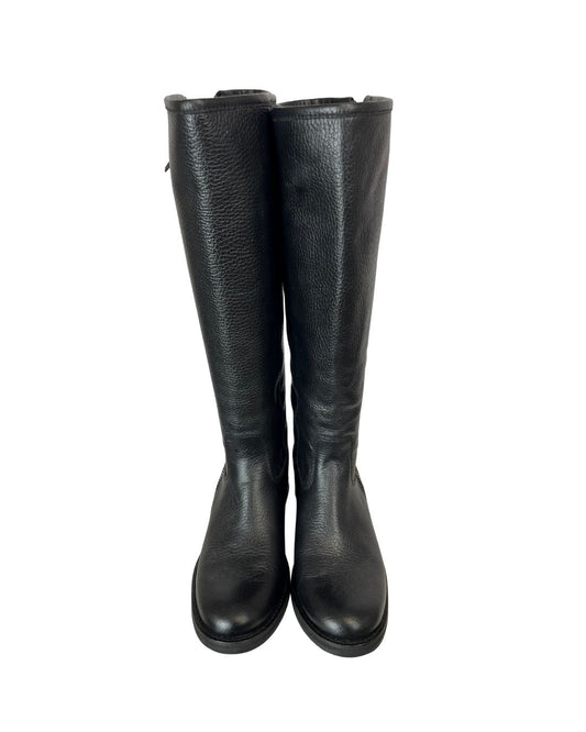 Front view of black leather zip-up riding boots